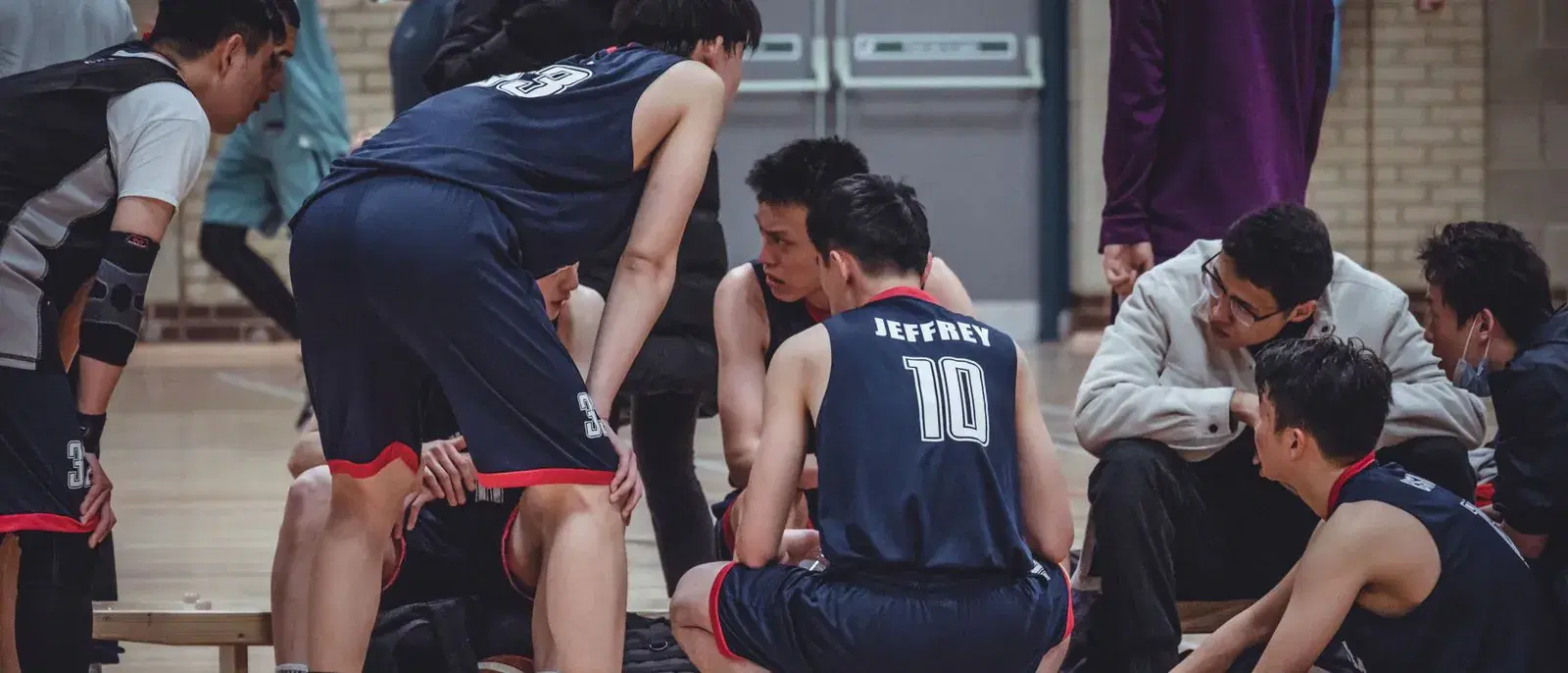 A team huddled together before a session